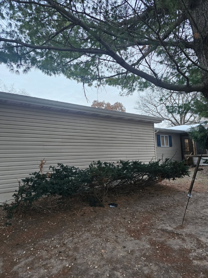 Same home with new siding installed after replacement